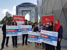 Winners posing with their prizes, together with eTRADE Unit team